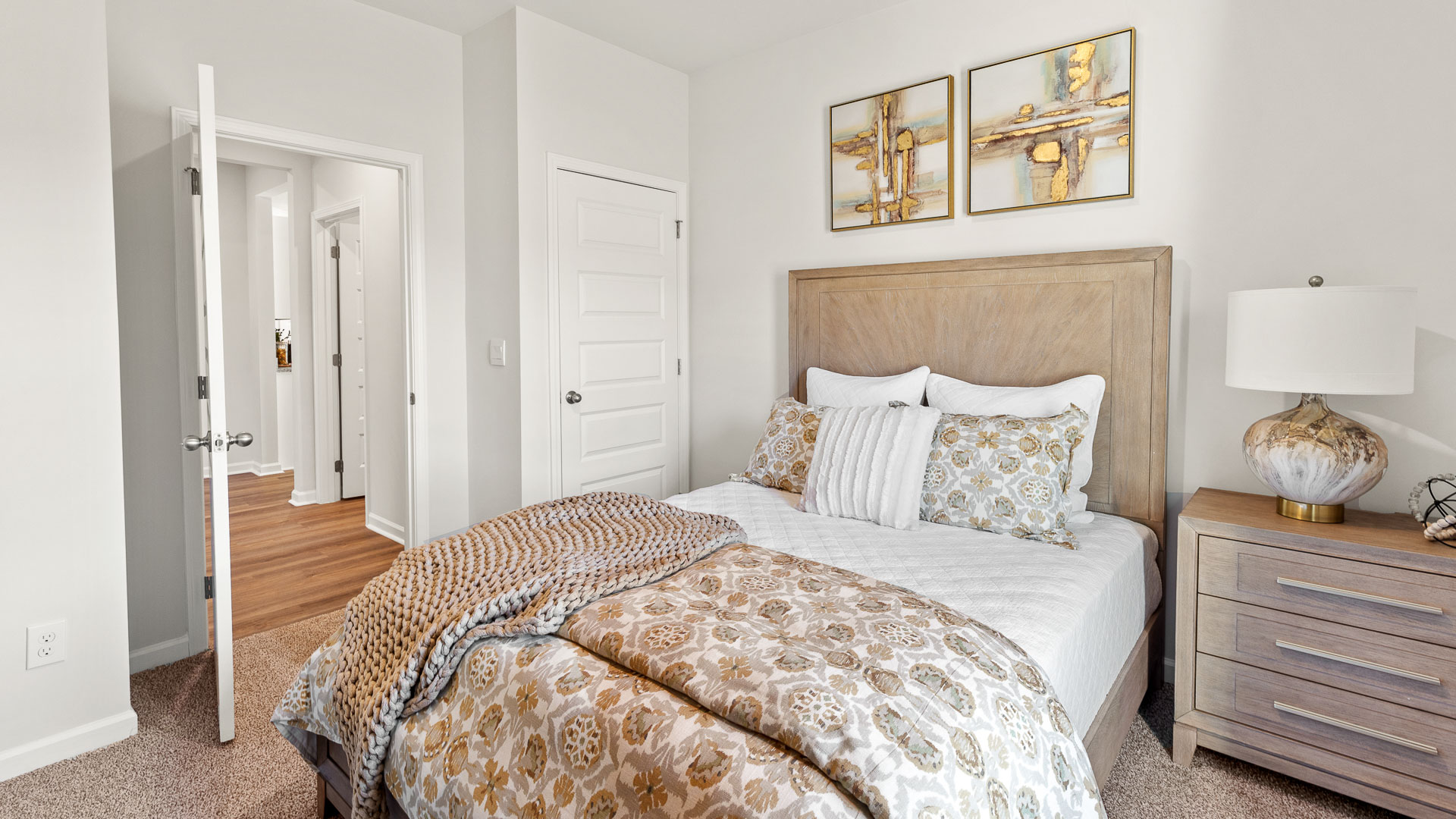 Secondary bedroom with carpet and window
