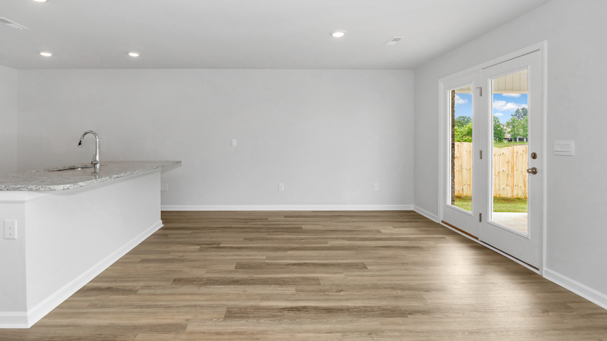 Kitchen island with view of dining / living room area