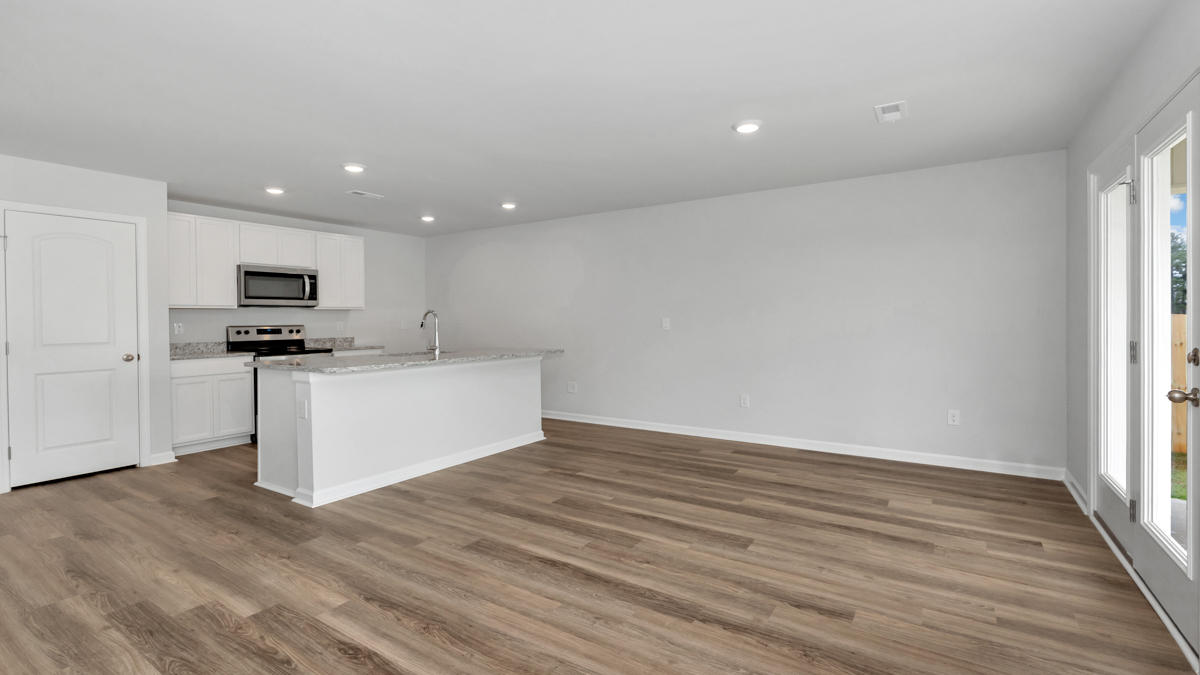 Kitchen island with view of dining / living room area
