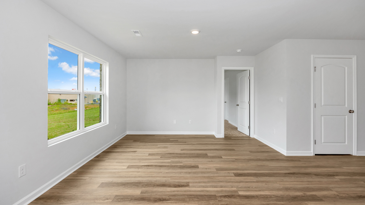 Dining room area with LVP flooring and windows