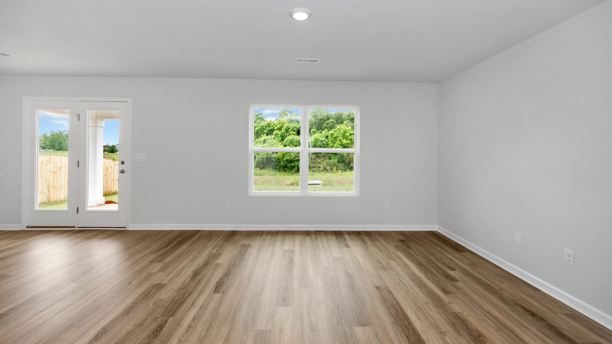 Dining room area with LVP flooring and windows