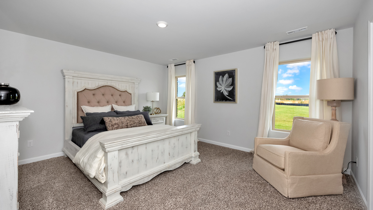 Primary bedroom with carpet