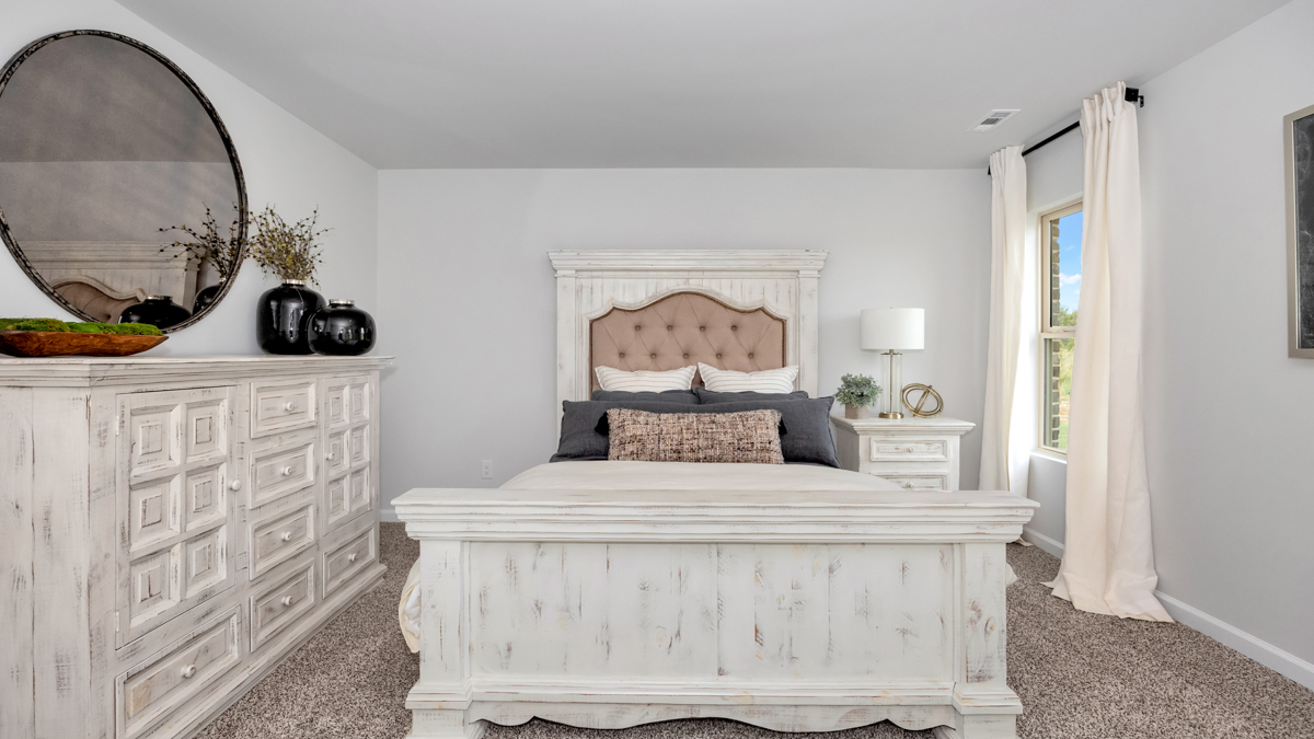 Primary bedroom with carpet