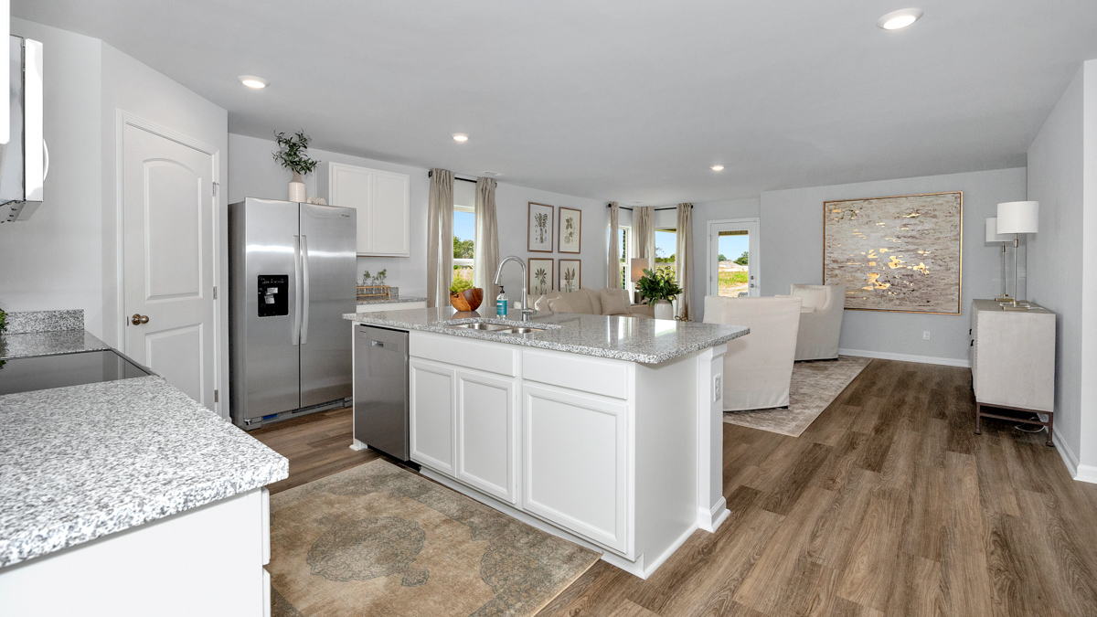 Kitchen island with view of dining / living room area