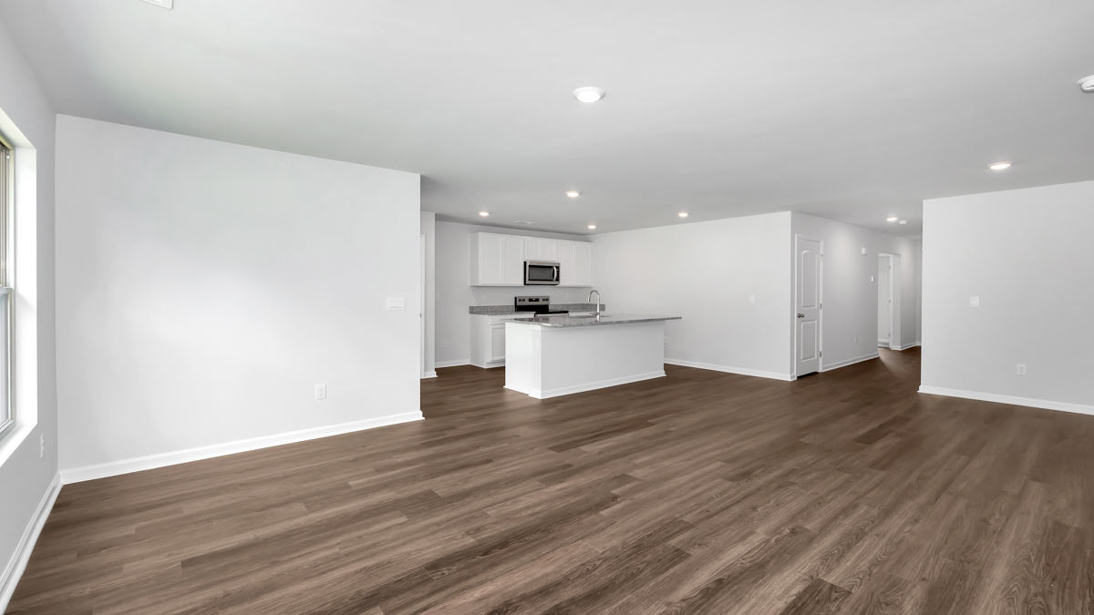 Kitchen island with view of dining / living room area