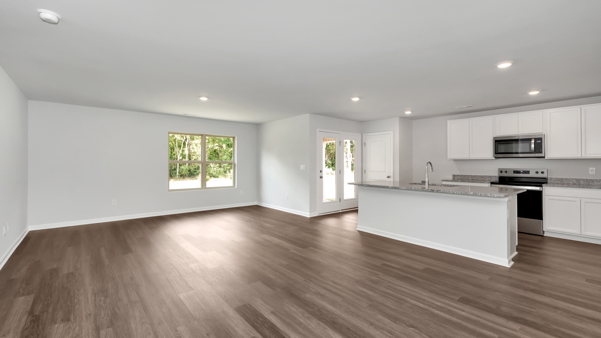 Kitchen island with view of dining / living room area