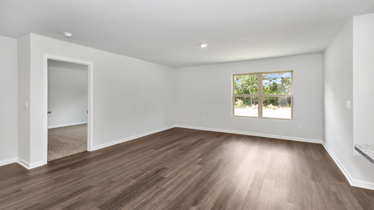 Dining room area with LVP flooring and windows