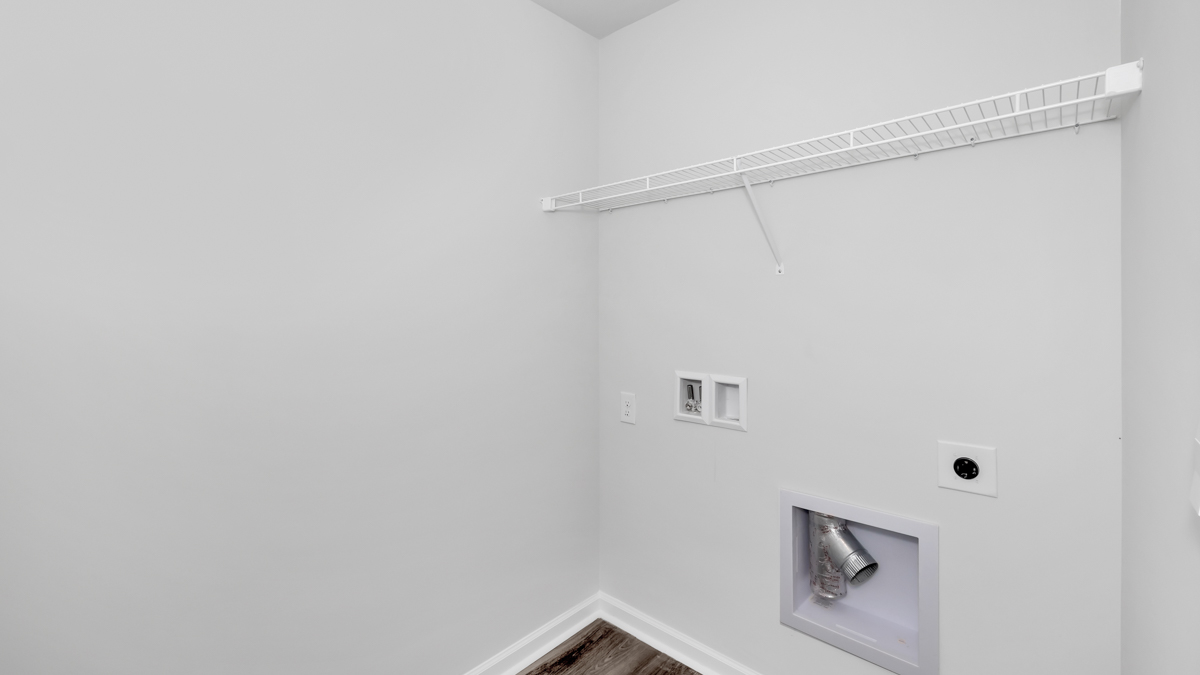 Laundry room with wire shelf and washer dryer hook up