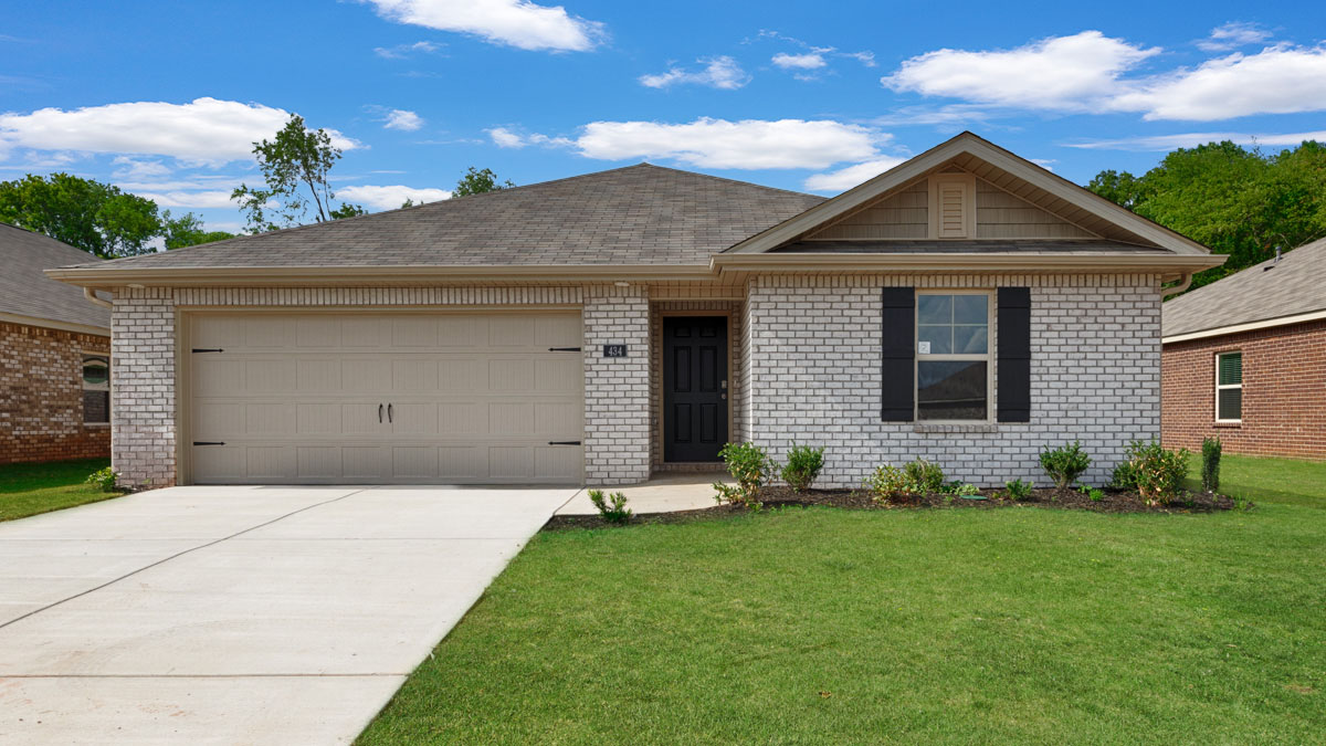 Single story home with brick and two car garage