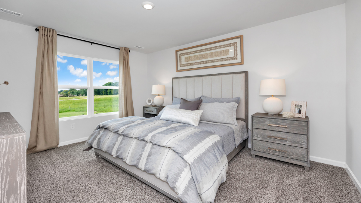 Primary bedroom with carpet