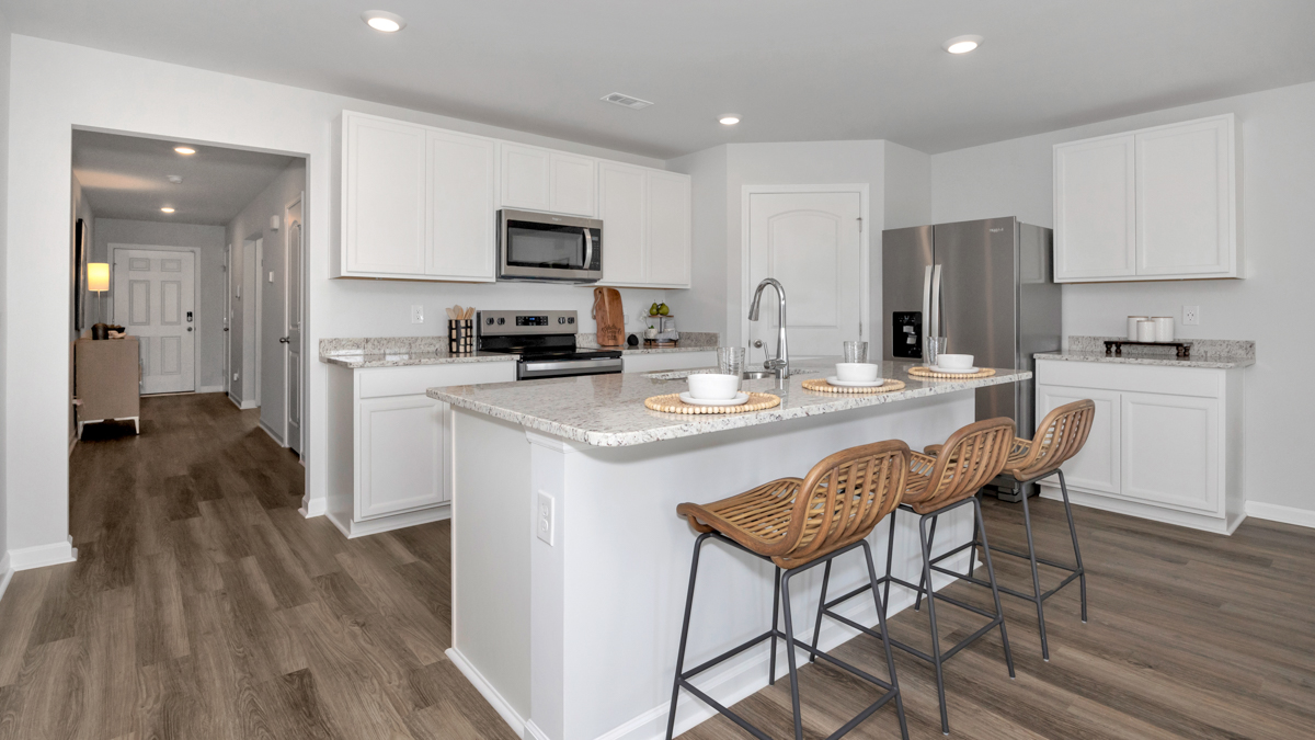 kitchen island with view of the foyer