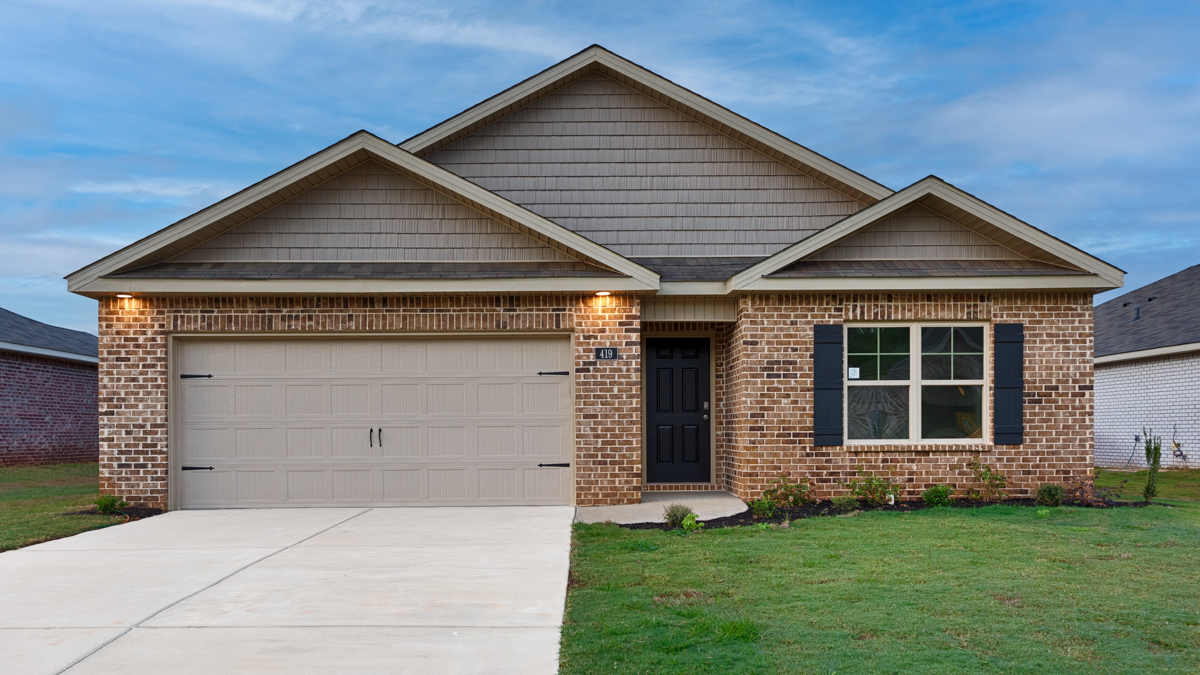 Single story home with brick and two car garage