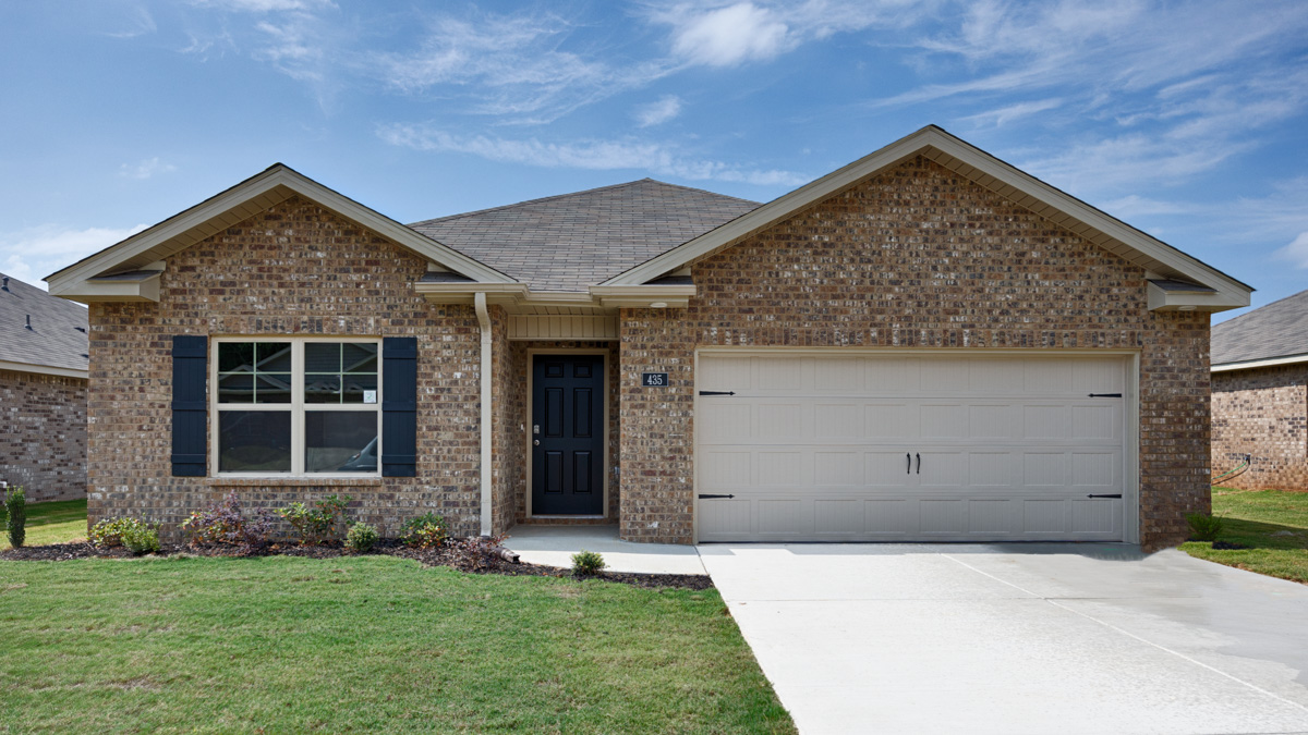 Single story home with brick and two car garage