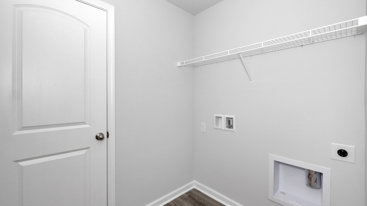 Laundry room with wire shelf and washer dryer hook up