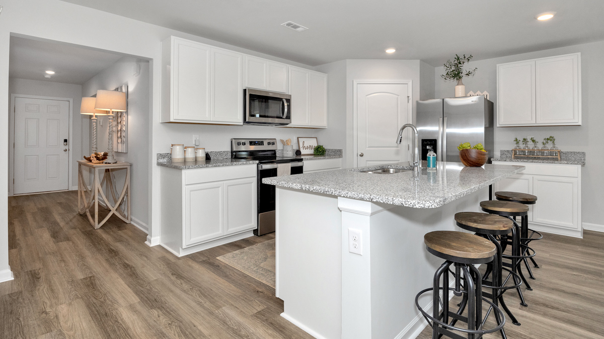 kitchen island with view of the foyer