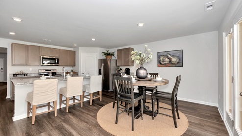 Kitchen island with view of dining / living room area