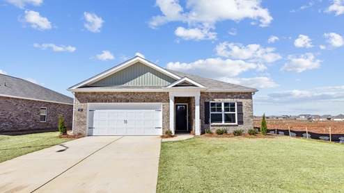 Single story home with brick and two car garage