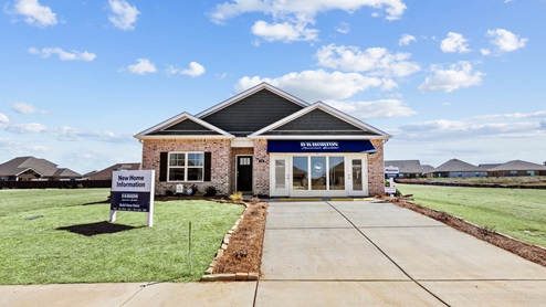Single story home with brick and two car garage
