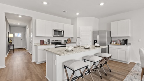 kitchen island with view of the foyer