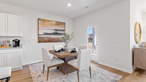 Dining room area with LVP flooring and windows