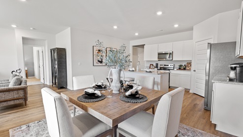Dining room area with LVP flooring and windows
