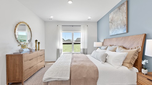 Primary bedroom with carpet
