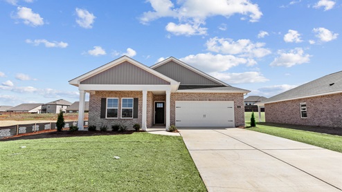 Single story home with brick and two car garage