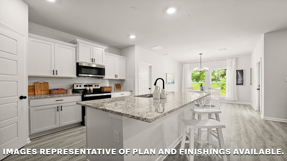 white kitchen island with stainless steel appliances and dining-room