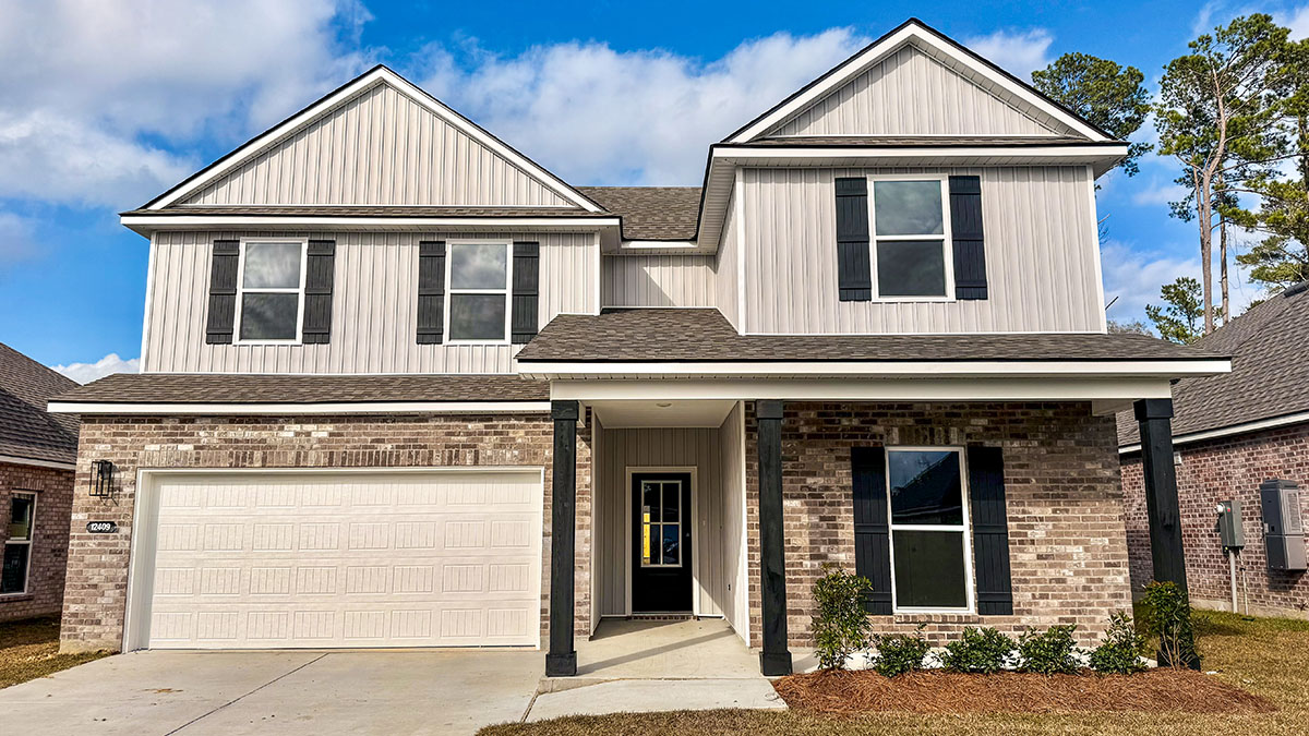 double-story home with tan-gray brick and light gray vinyl siding and black front door and shutters with porch and two-car garage