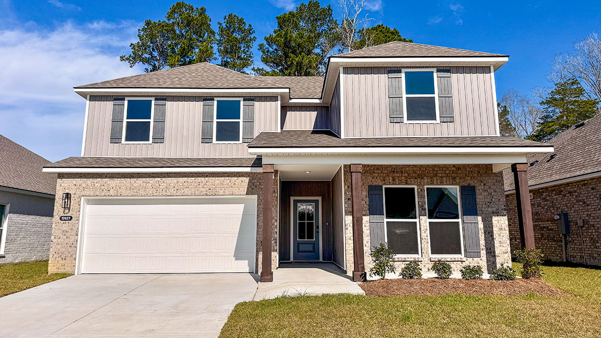 double-story home with tan brick and light gray vinyl siding with gray front door and shutters with porch and two-car garage