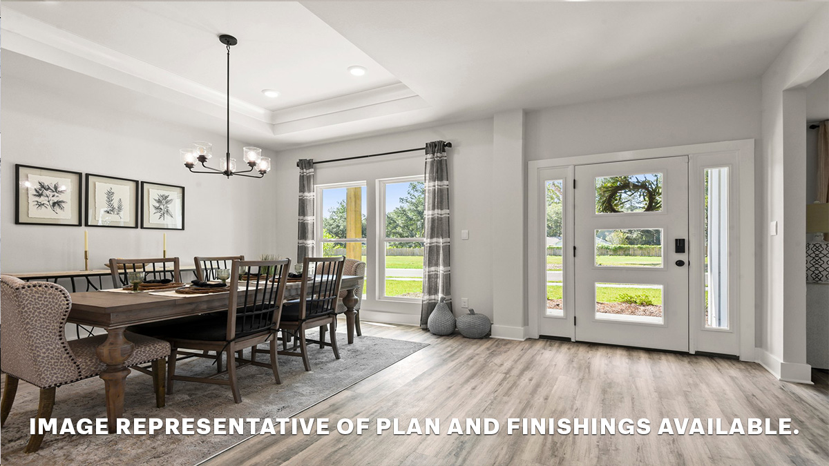 Large dining room space in front of home with vaulted ceilings near office space