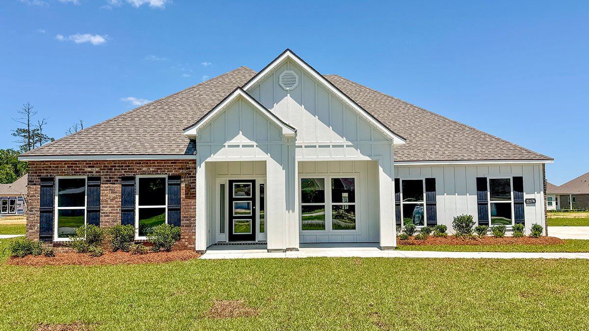 single-story home with redish brick with white hardie vinyl and black front door and shutters