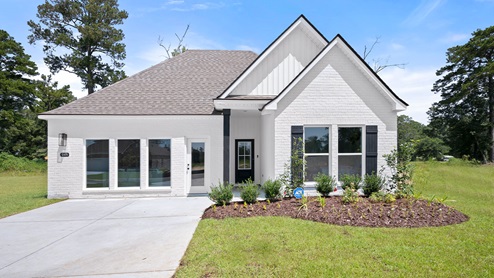 single-story home with white hardie vinyl and black front door and shutters-model home of belmont