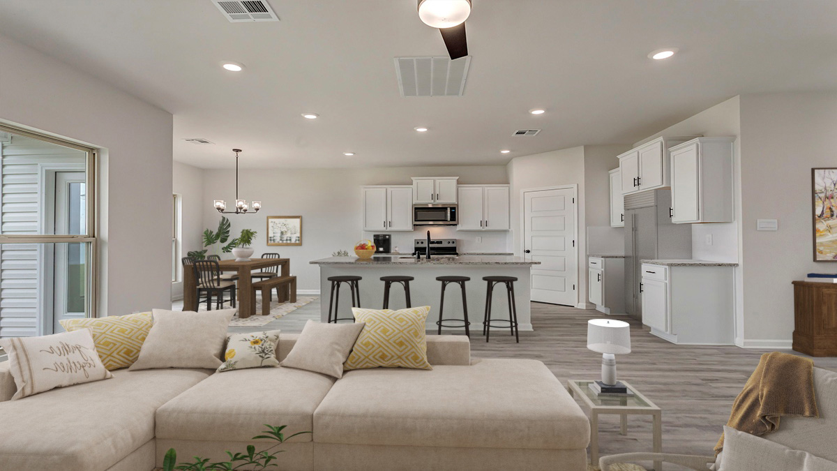 Spacious living room with opening to open-concept kitchen and dining room