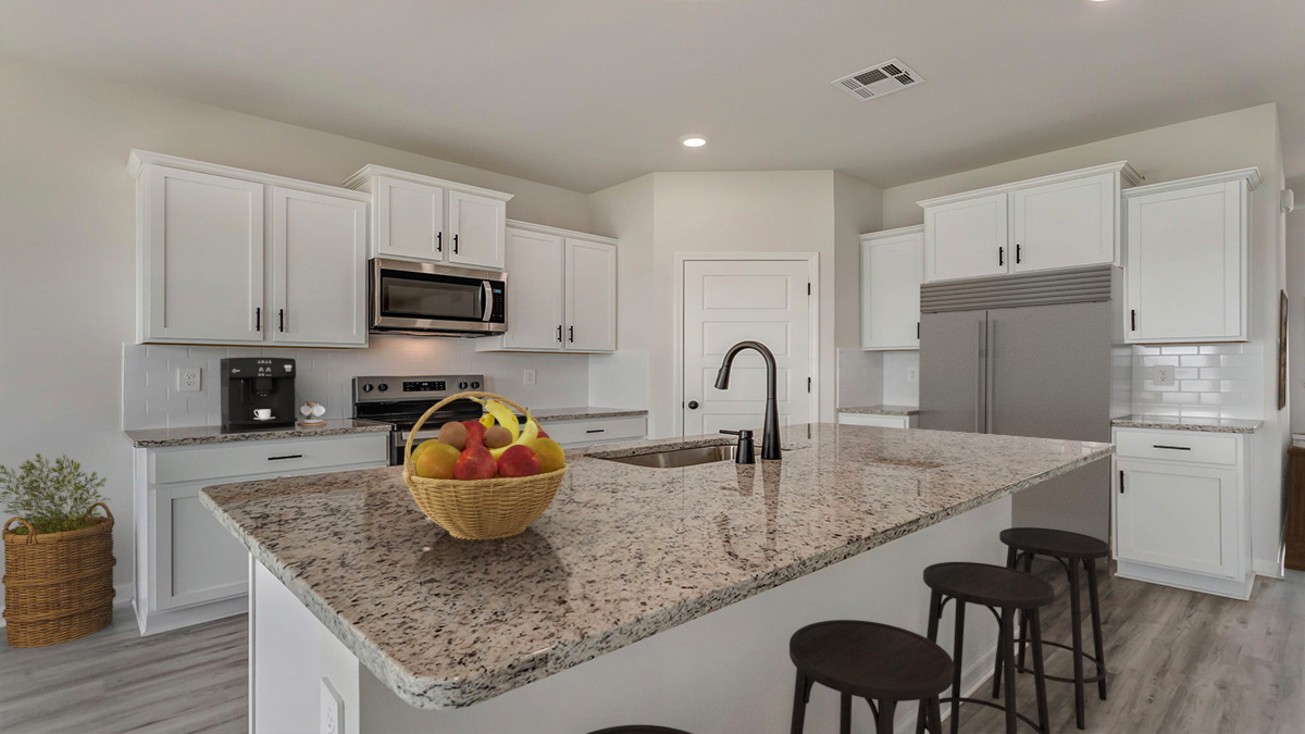 White kitchen island with stainless steel appliances