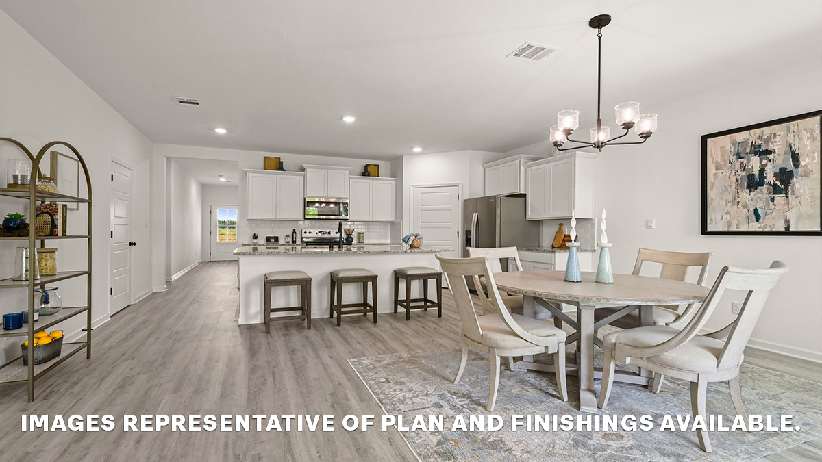 open-concept dining space with access to patio