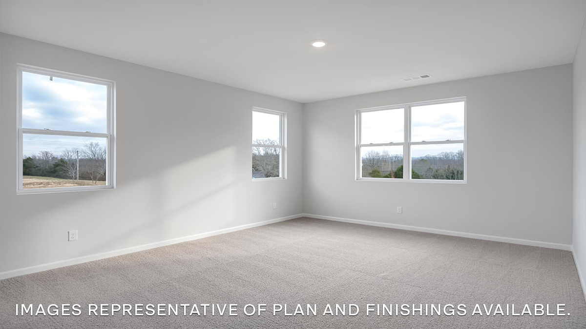 primary bedroom with three windows