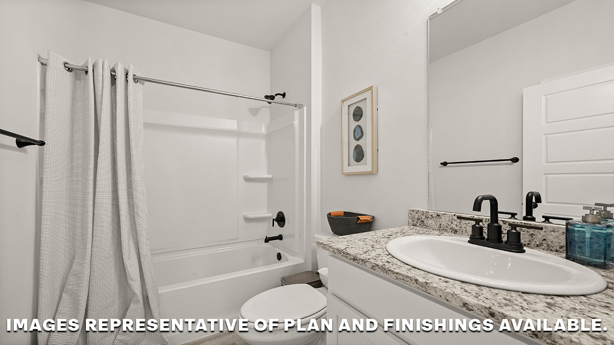 guest bathroom with vanity and shower tub combo