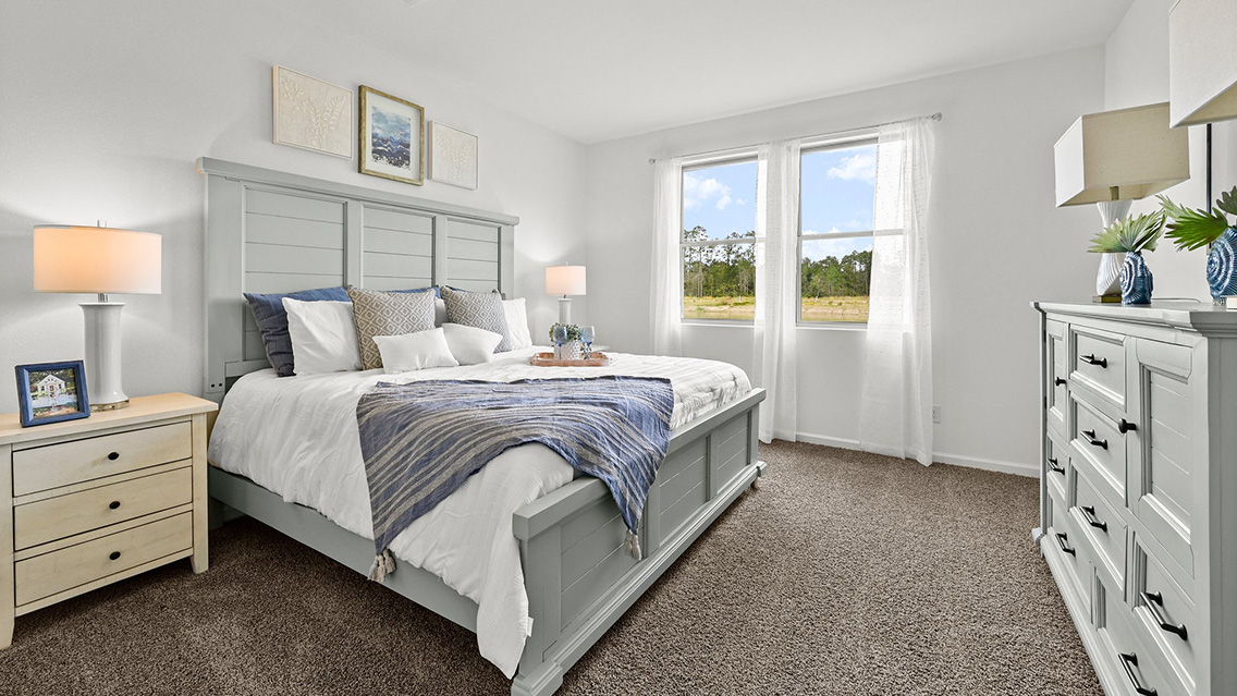 primary bedroom with room for a king-sized bed and rear facing window
