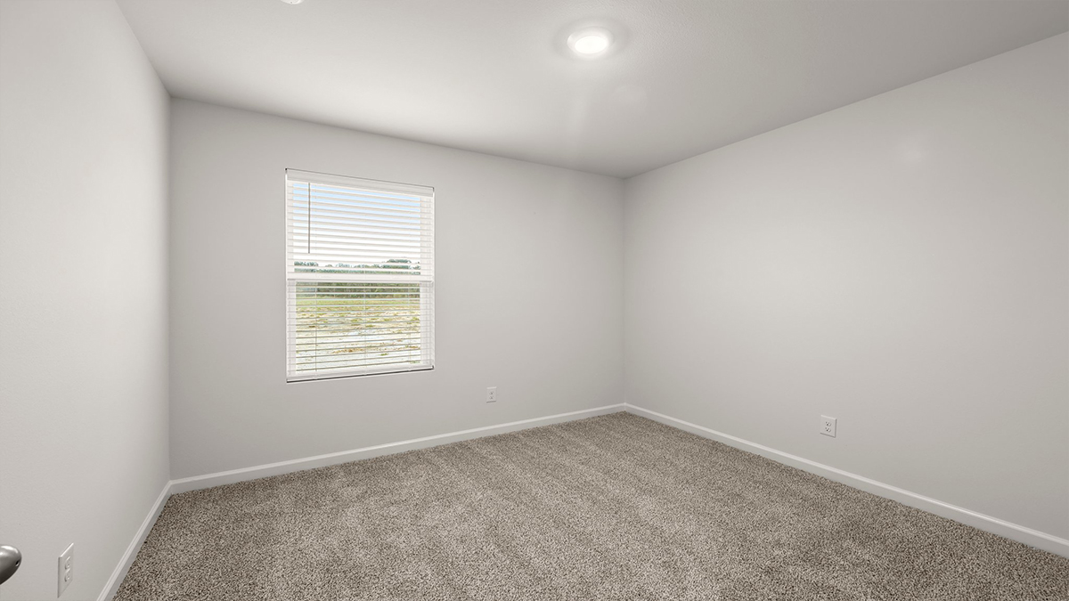 fourth bedroom with single window with space for a full bed