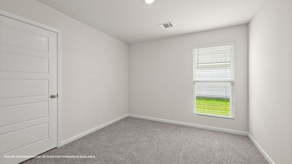second bedroom with single window and room for a queen bed