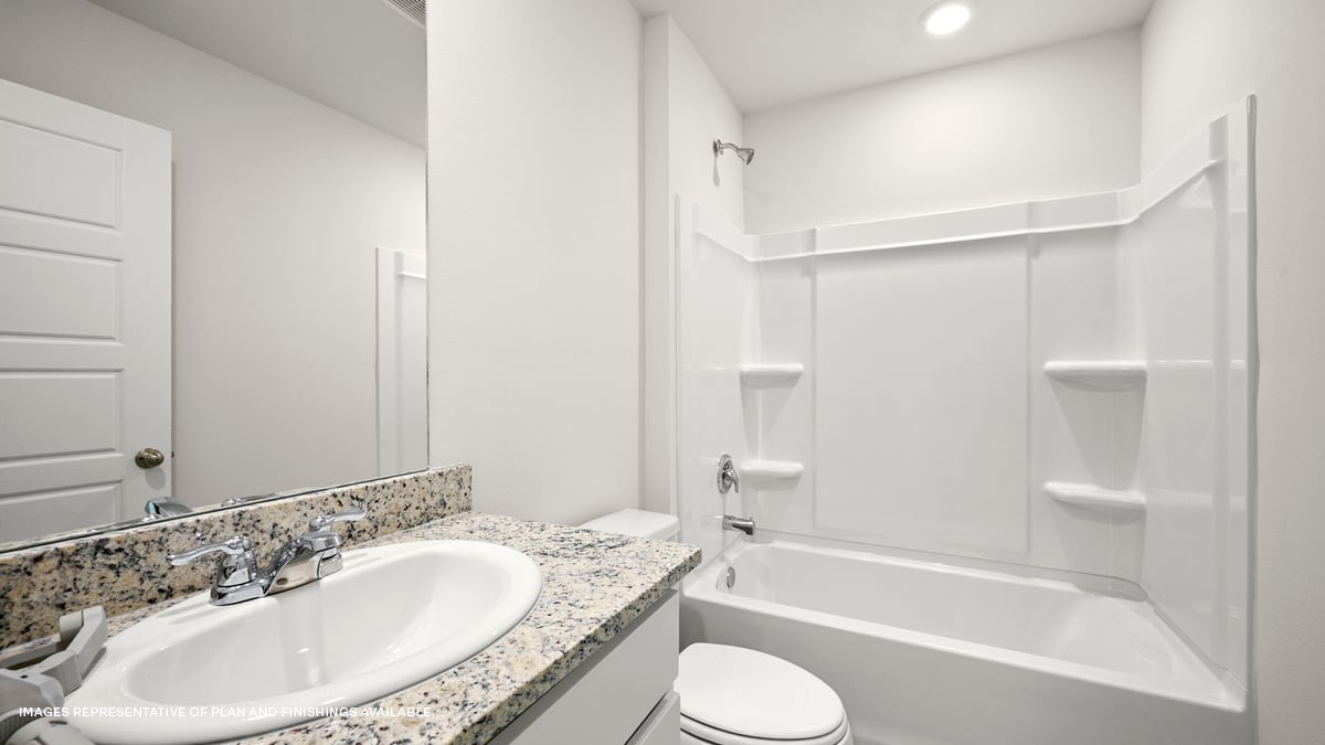 second bathroom with single vanity and toilet and shower tub combo