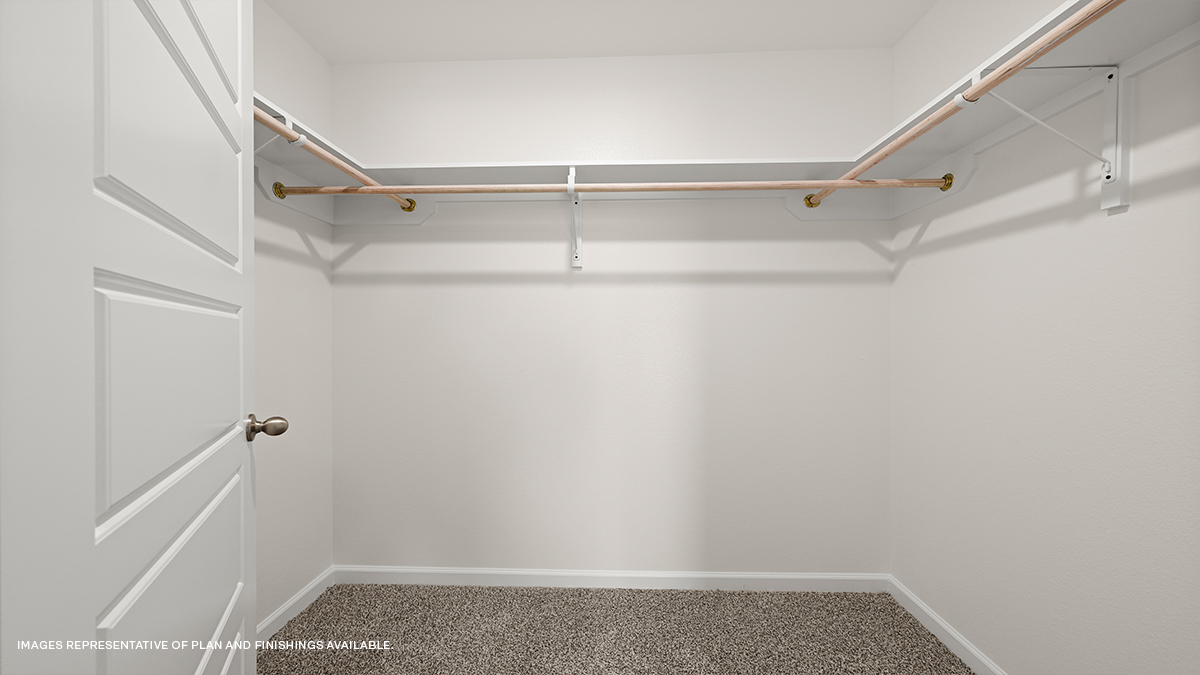 walk in closet in primary bedroom