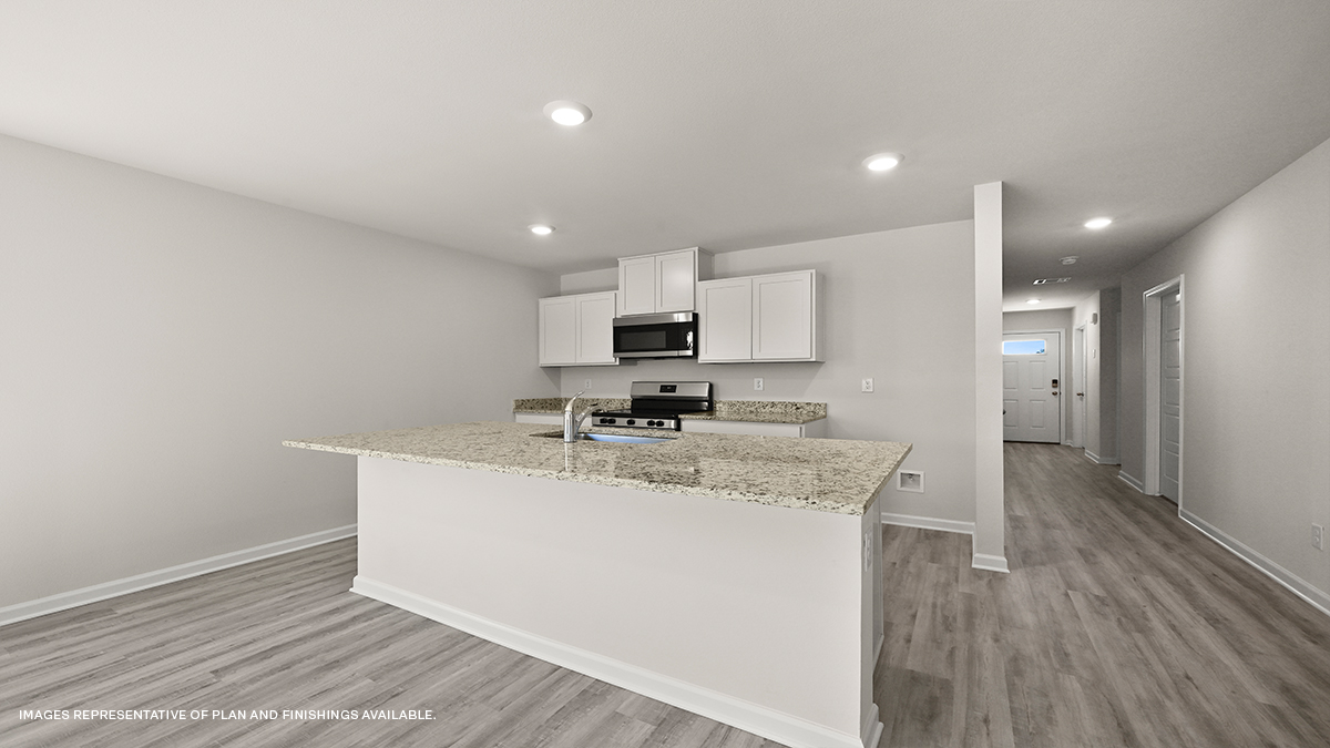 gray kitchen island with stainless steel appliances