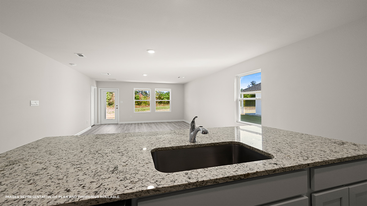 gray kitchen island with stainless steel appliances