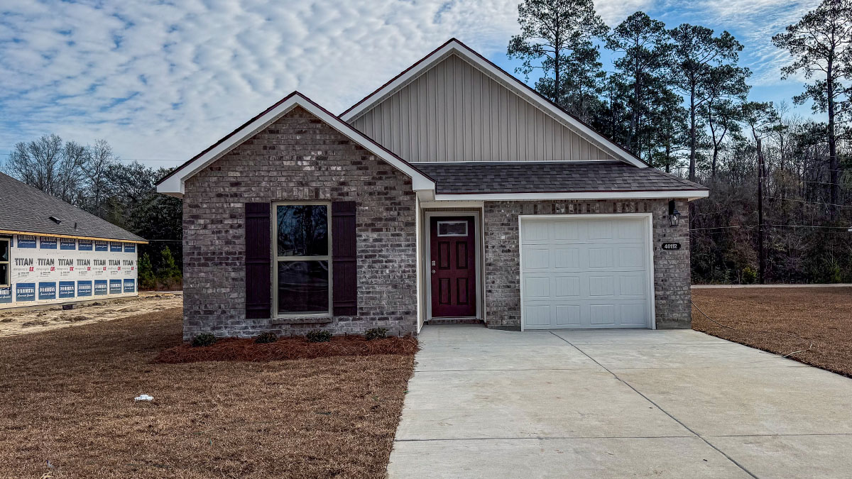 single-story home with brown brick and tan vinyl siding with brown front door and shutters and one-car garage