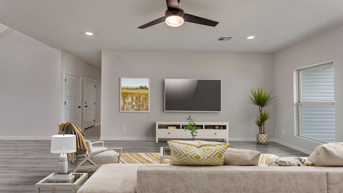 Open-concept living space with access to garage