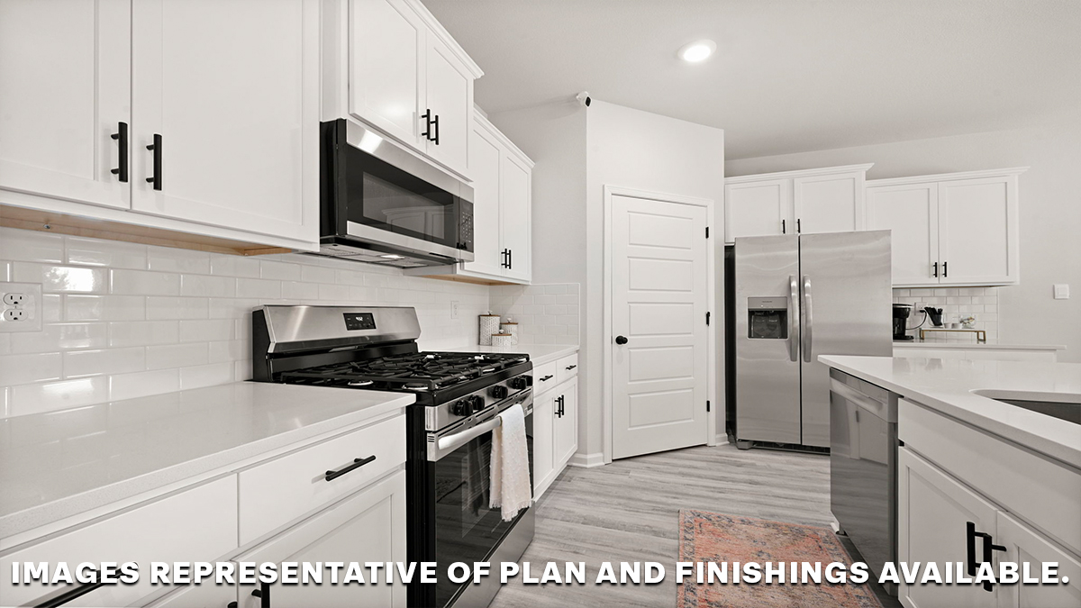 white quartz kitchen island with stainless steel appliances