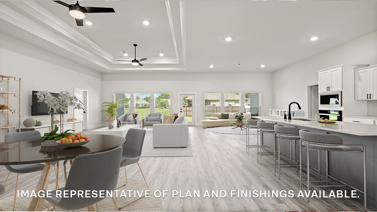 Open-concept living room and kitchen and eat in kitchen area with vaulted high ceilings and stainless steel gas appliances