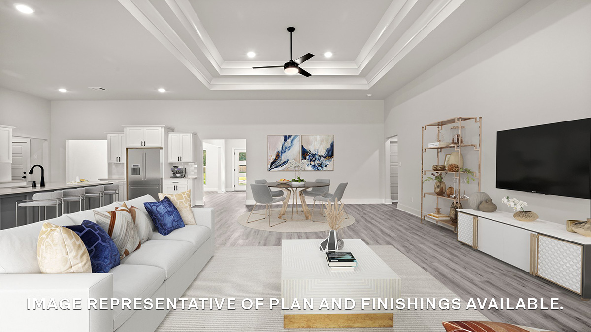 Open-concept living room with vaulted high ceilings and hallway to front of home